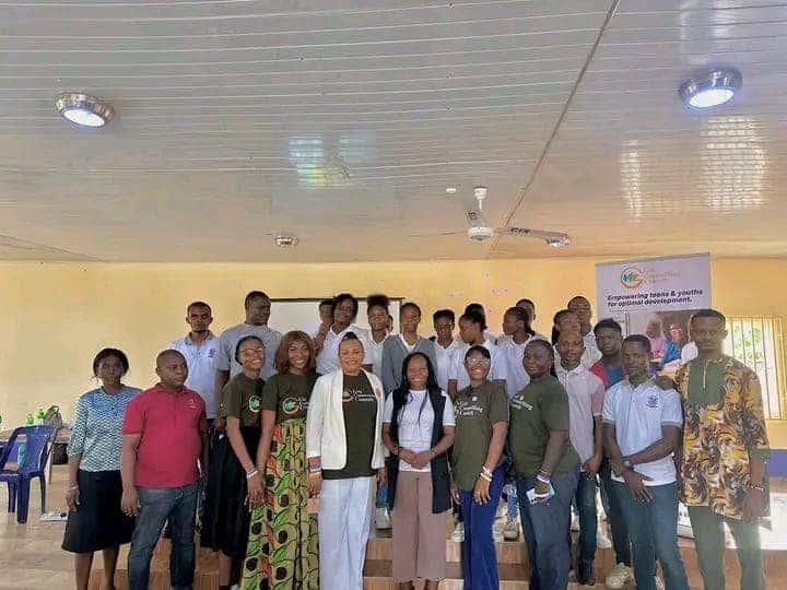 Gilt Counselling Consult team and Christ International School staff group photo with event banner
