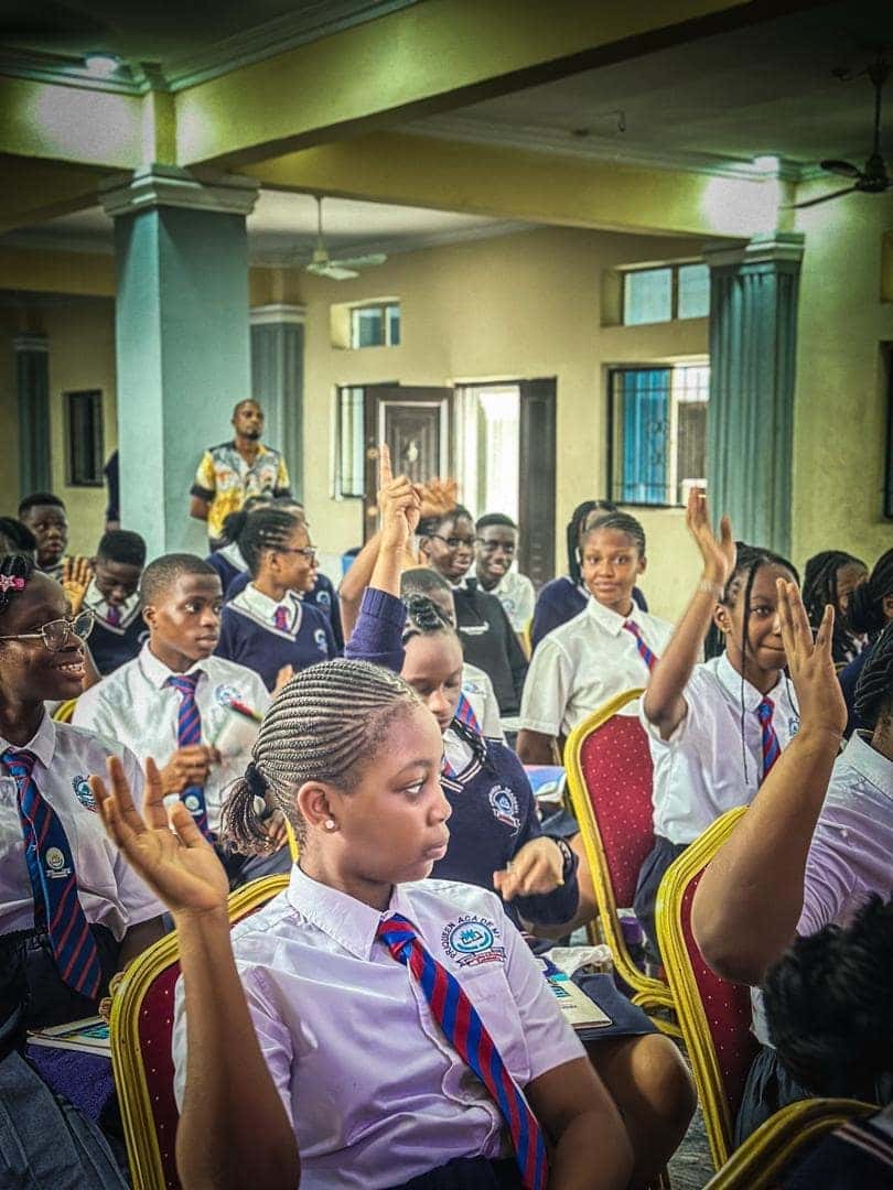 Priqueen International Academy students raising their hands to participate in the session